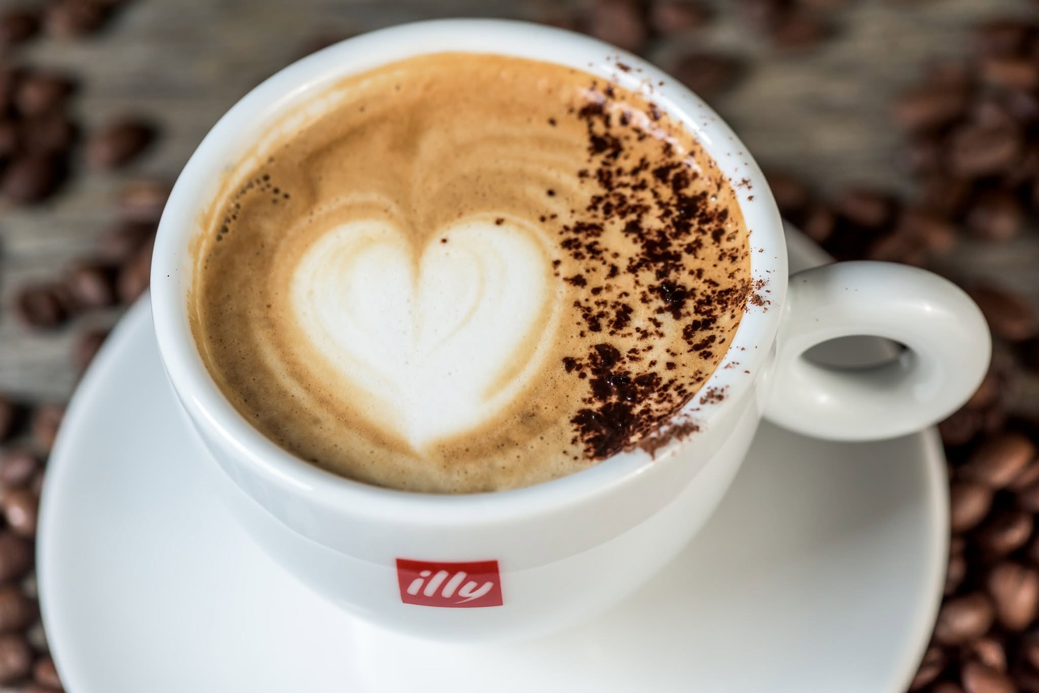 Heart latte art in a white cup, the photograph used on Café Gara’s Facebook cover.